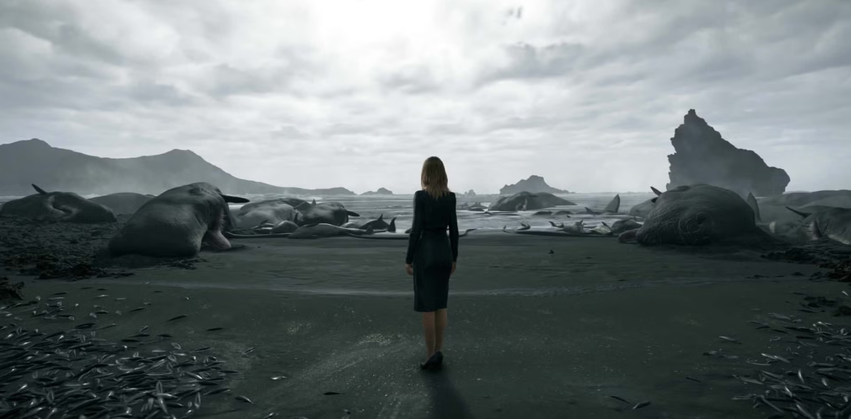A desolate, otherworldly landscape depicting The Beach in Death Stranding, with dark sands, a cloudy sky, and stranded marine life, symbolizing the connection between life and death.